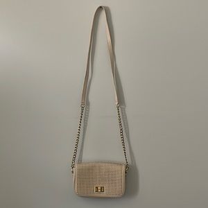 Off white small shoulder/sling purse. Gold chain & synthetic leather material